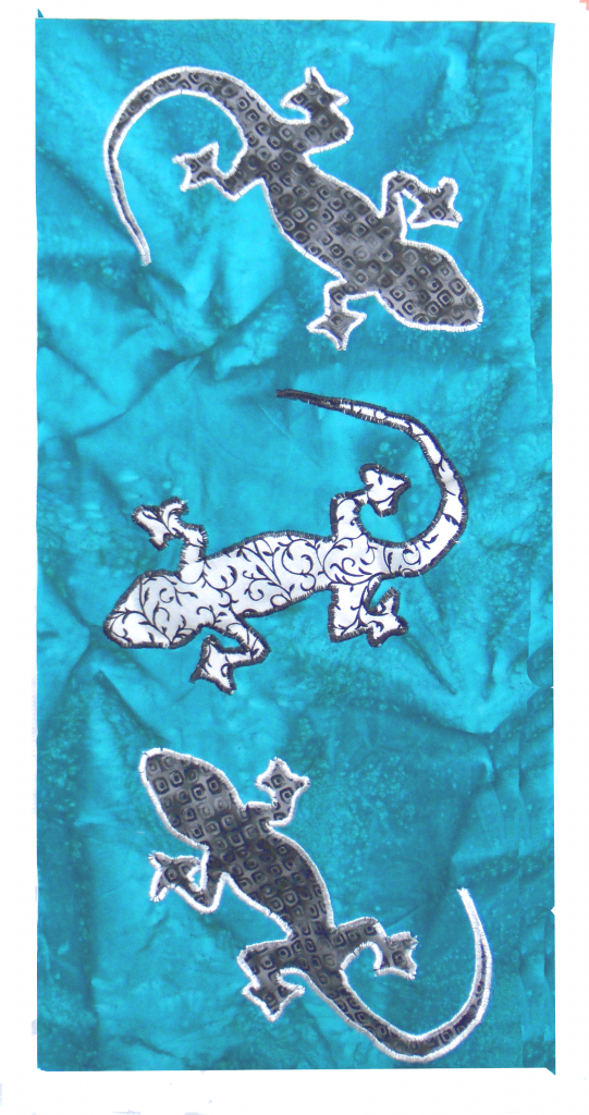 Wall Hanging decorated with applique geckos